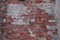 Old dilapidated red brick wall