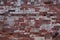 Old dilapidated red brick wall