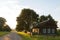 Old dilapidated village house at sunset day