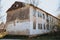 Old dilapidated, weather-beaten house that needs to be renovated. Housing problem