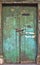 Old dilapidated wooden door.