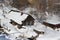 Old dilapidated wooden houses snow covered in winter