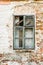 The old dilapidated wooden window frame