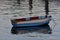 Old dinghy on calm water