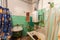 Old and dirty bathroom in the apartment that is prepared to demolition is the place for refugees for temporary period of