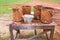 Old dirty bucket for construction on wooden table background