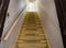 Old dirty damaged abandoned wooden stairs to the garret. Entrance to the attic.