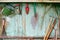 Old dirty farm gardening tools, spade, fork and rake on wooden wall