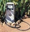 Old dirty gas station petrol pump in the desert.