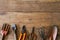 Old dirty grunge rusty gardening tools on dirty grunge wooden background