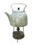 Old dirty kettle teapot on a kerosene burner over white