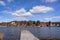 Old dirty pier or jetty for yachts and boats. Seagulls. Spring landscape of the coast of Sweden.