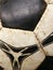 Old dirty soccer ball detail close-up