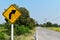 Old and dirty traffic signs beside asphalt road in countryside