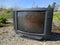 old and dirty tube tv outdoors close up photo