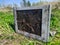 old and dirty tube tv outdoors close up photo