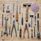 Old dirty vintage repair tools on wooden background