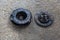 Old Disc Clutch and cover on floor. Old rusty clutch and the disc lies in the garage. Car rusty clutch pressure plate assembly  wi