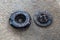 Old Disc Clutch and cover on floor. Old rusty clutch and the disc lies in the garage. Car rusty clutch pressure plate assembly  wi