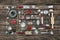 Old dishes and cutlery on a wooden background in red, silver and