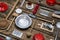 Old dishes and cutlery on a wooden background in red, silver and