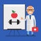 Old doctor points to flip chart with picture apple and dumbbell