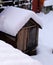 old dog house covered with snow, shelter for dogs