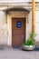 The old door with blue post box.