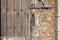 Old door deteriorated by time, made of wood and rusty sheet metal. Antique