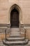 Old door of a historical building with stairway