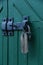 Old doors gates closed with black metall padlock with hasp