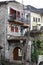 Old doors and windows damaged from weather in ancient city of Gjirokaster in Albania exploring Balkan stock photography travel