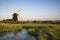 Old drainage windpump windmill in English countryside landscape