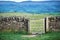 Old dry stone wall in welsh countryside, mountains in background