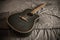 Old dusty acoustic cutaway guitar