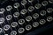 Old dusty black typewriter keyboard