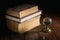 Old dusty books with glass globe.