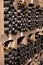 Old dusty bottles of red rioja wine in cellars, wine making in La Rioja region, Spain