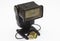 An old dusty National photographic flash unit from the film era that has been adapted for permanent use as a remote flash unit wit