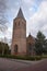 Old Dutch church next to a road