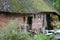 Old dutch farm barn with thatched roof