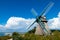 Old dutch style windmill in beautiful landscape close to the baltic sea