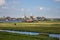 Old dutch windmills and river in historical village. Holland mills in field panoramic view. Rural holland landscape.