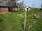 Old earth cold cellar built into a hill beside a house