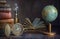Old earth globe, compass, books and lamp on the table. In the cabinet of a traveler, explorer, investigator, discoverer. Concept