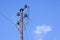 Old electric pillar with glass insulators and disconnected wires