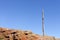 Old electrity pole on a rocky hill