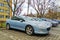 Old elegant popular sedan car blue Peugeot 407 parked