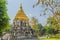 Old elephant chedi with golden top pagoda at Wat Chiang Man or Wat Chiang Mun, the oldest temple in Chiang Mai, Thailand, built in