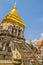 Old elephant chedi with golden top pagoda at Wat Chiang Man or Wat Chiang Mun, the oldest temple in Chiang Mai, Thailand, built in